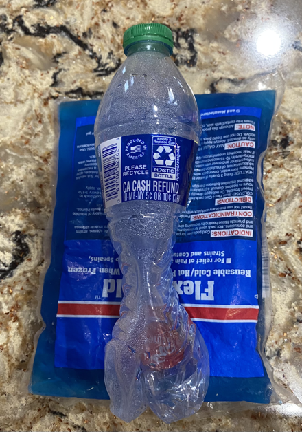 Crushed bottle on ice pack sideways